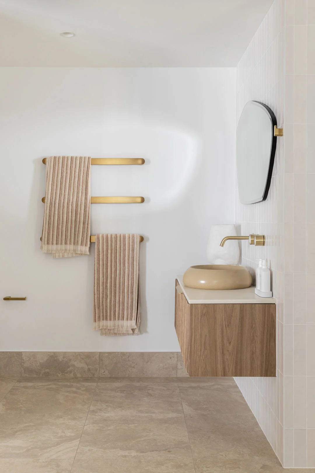 A-modern-coastal-bathroom-with-warm-timber-and-brushed-brass-tapware