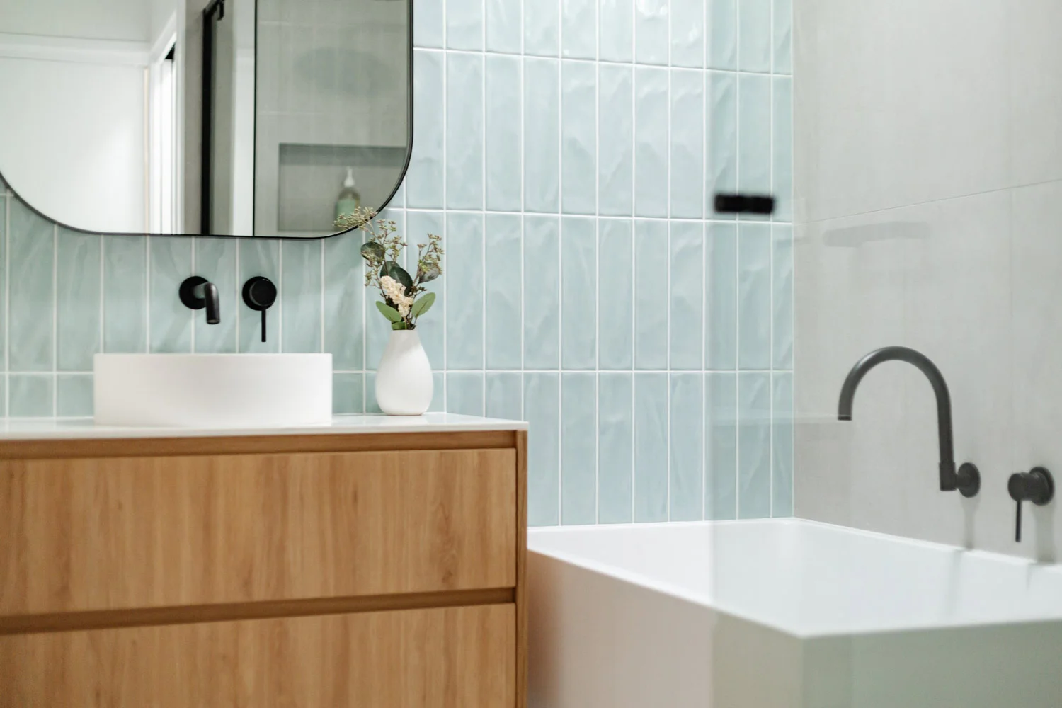Ronald-McDonald-ABI-Interiors-Blue-Tiles-Oak-Cabinet-Matte-Black-Tapware