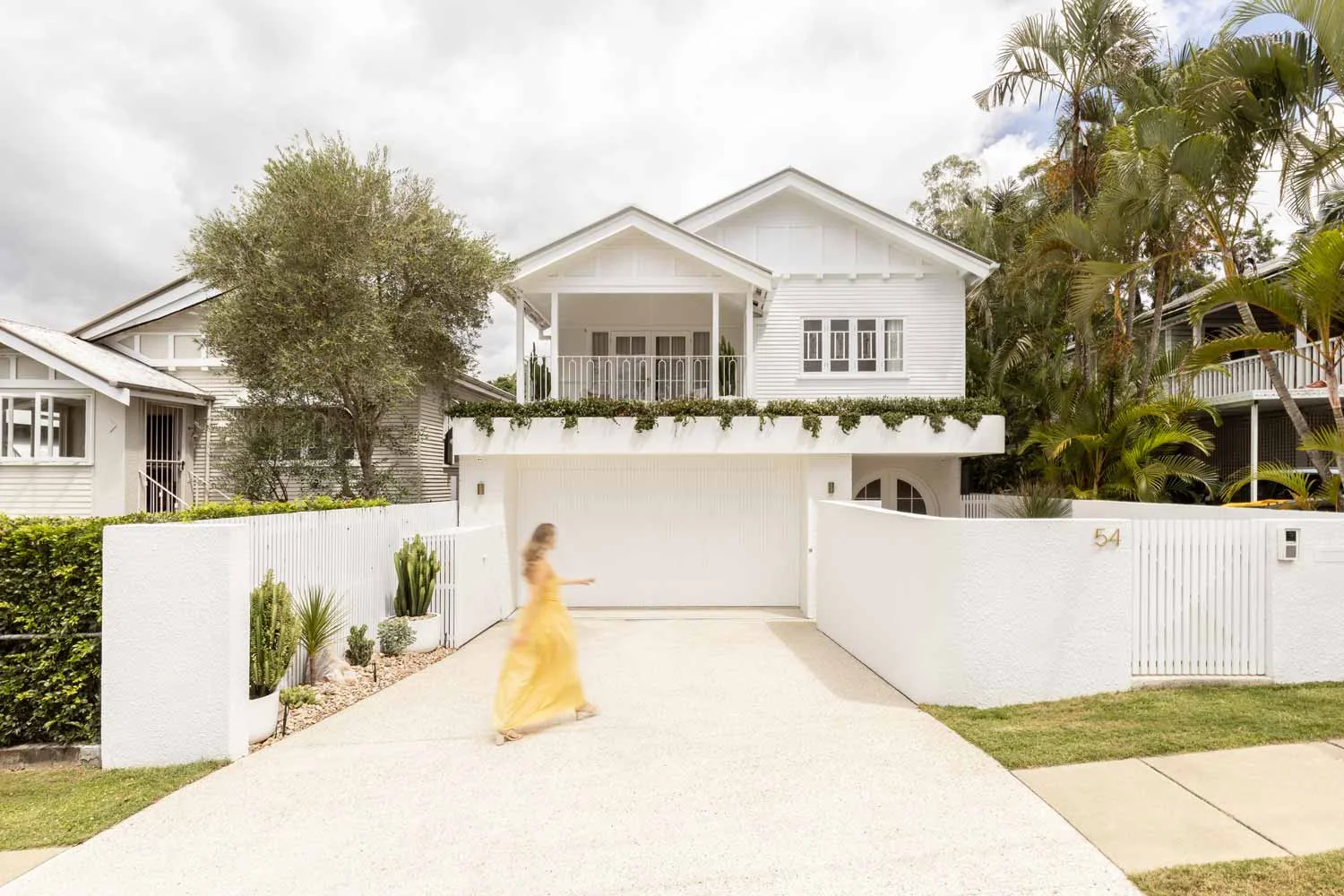 white-queenslander-home-with-arch-french-doors