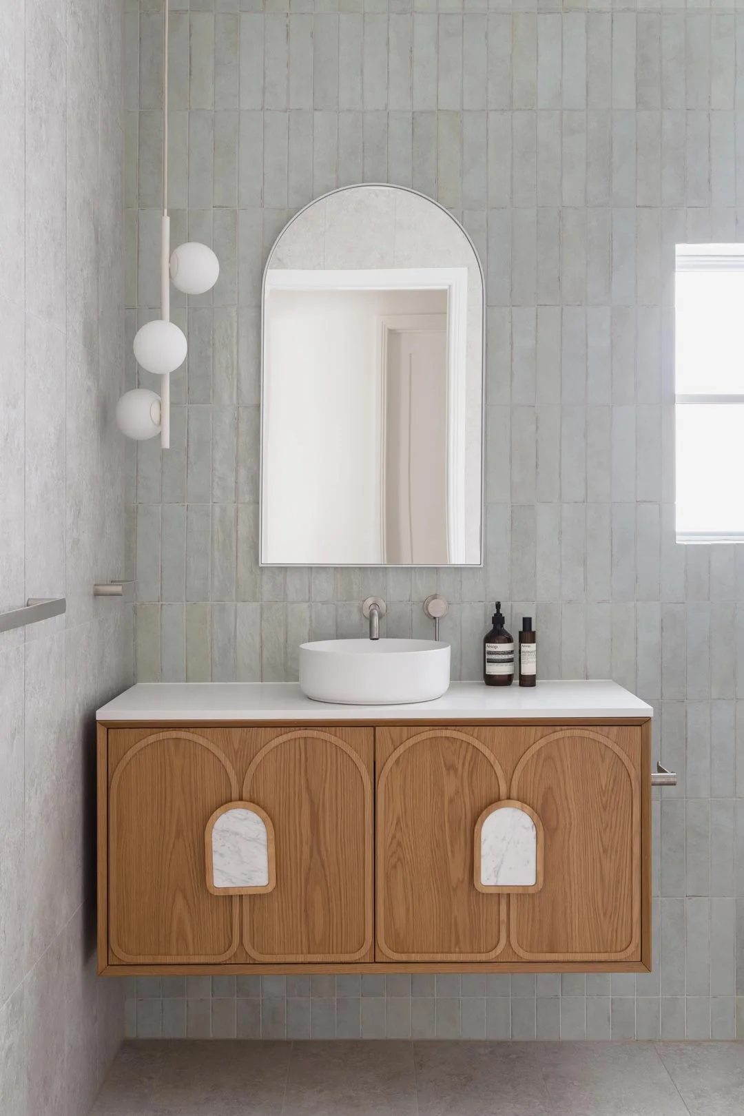 luxe-boho-bathroom-green-zelige-feature-wall-with-brushed-nickel-tapware