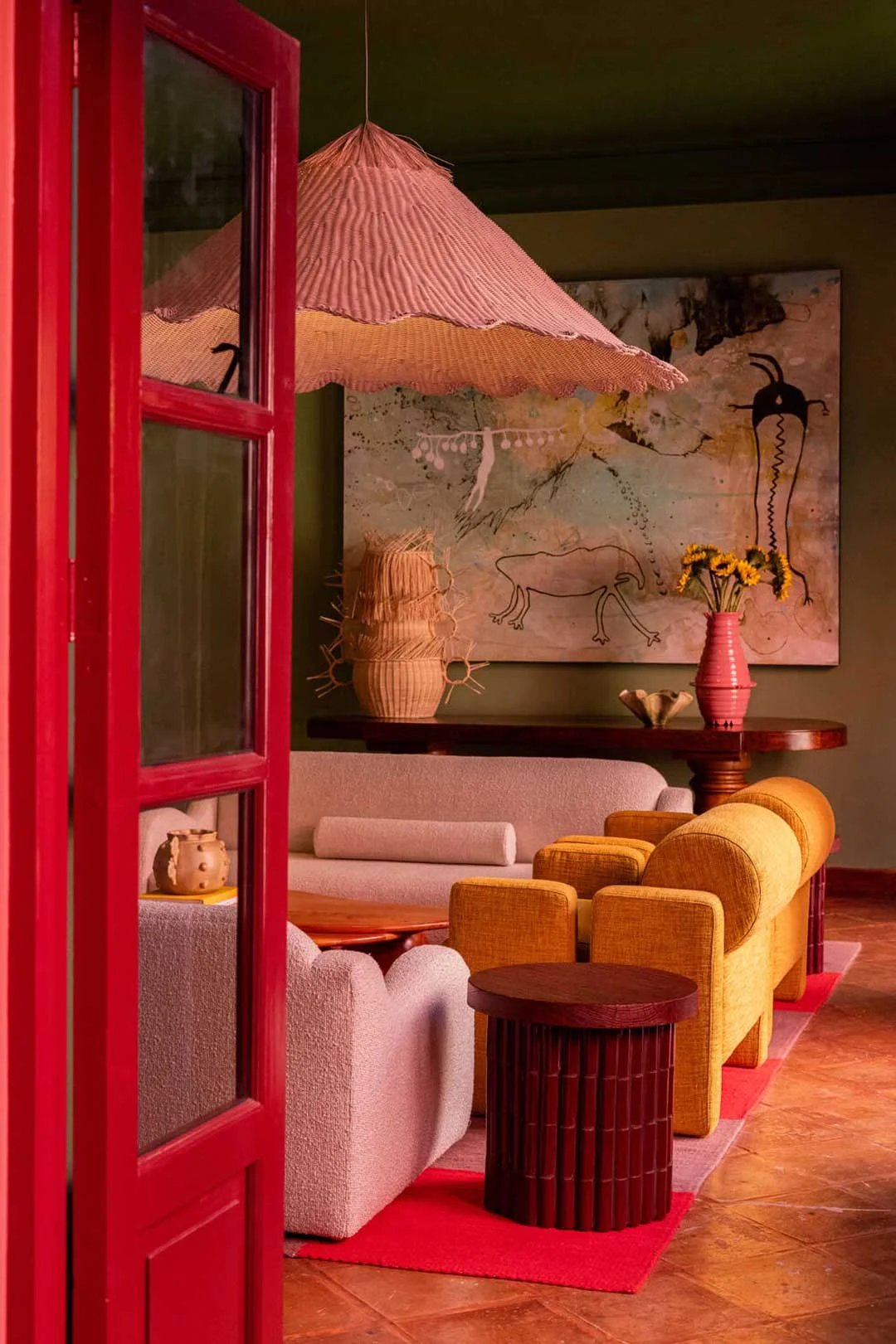 maximalist-decor-vibrant-red-door-pink-couch-and-green-walls