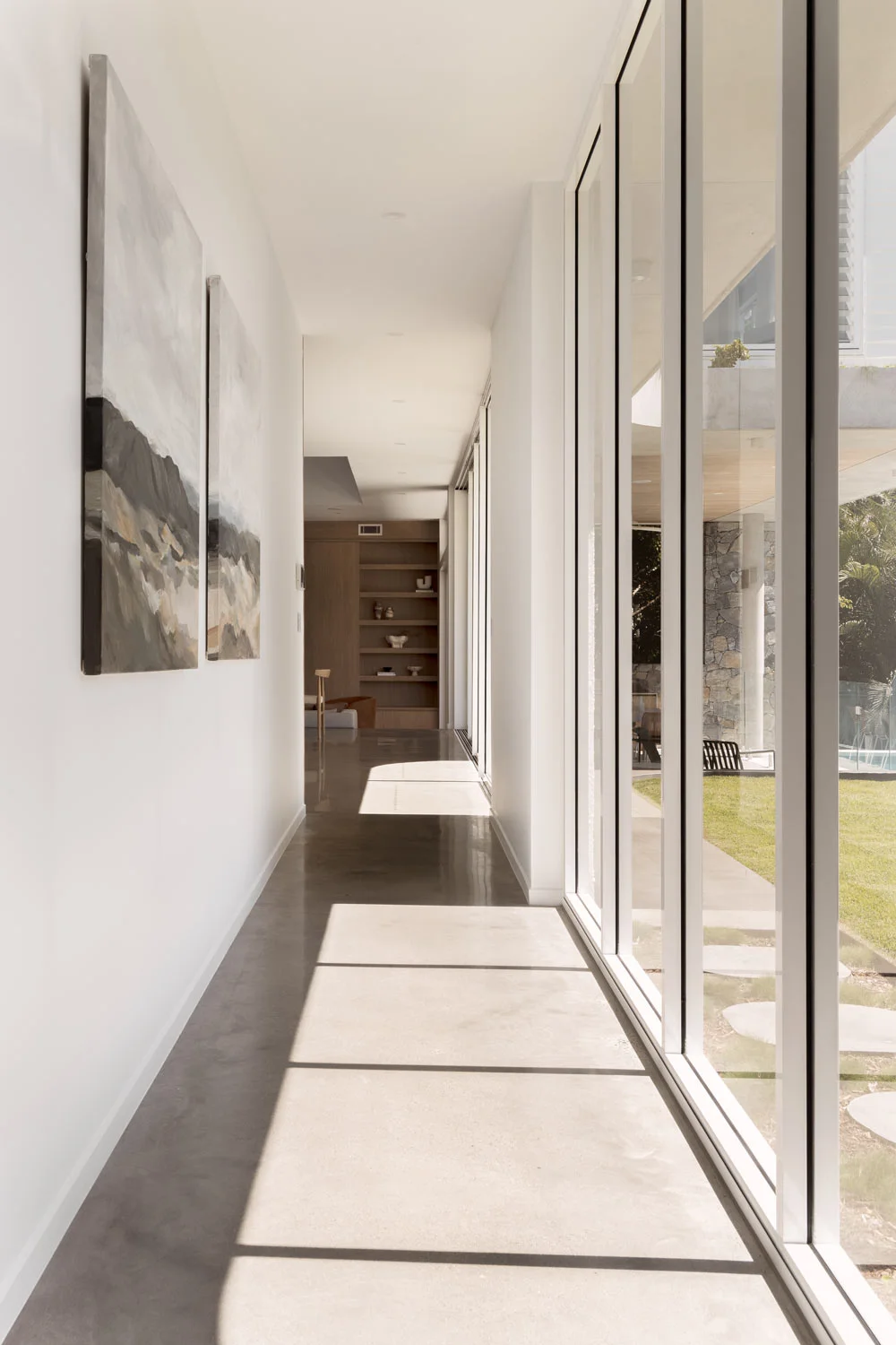 Contemporary-Interior-Design-Polished-Concrete-Flooring-Floor-to-Ceiling-Windows-Indoor-Outdoor-Living
