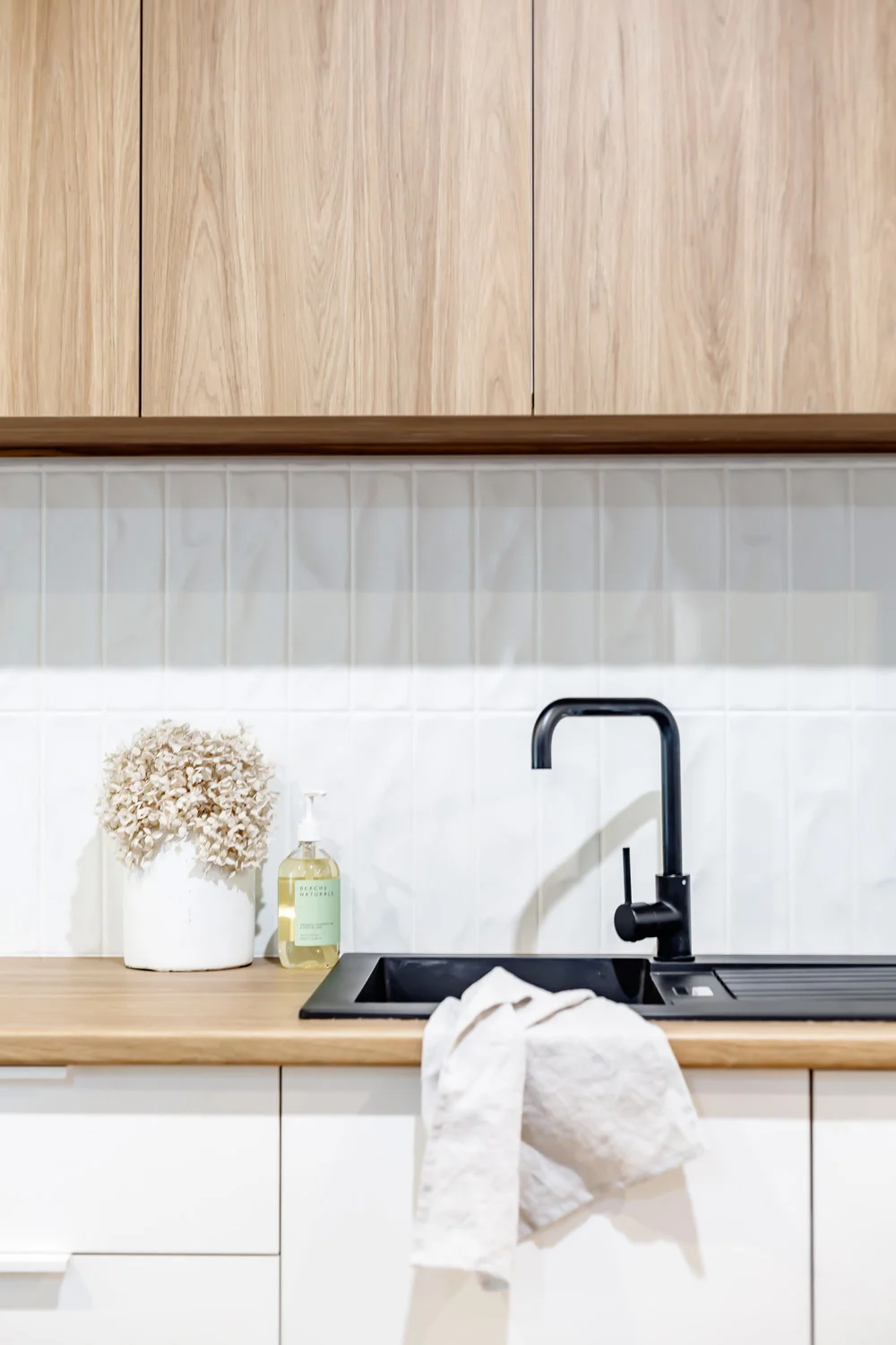 Ronald-McDonald-Charity-Kitchen-Matte-Black-Tapware-Oak-White-Cabinetry