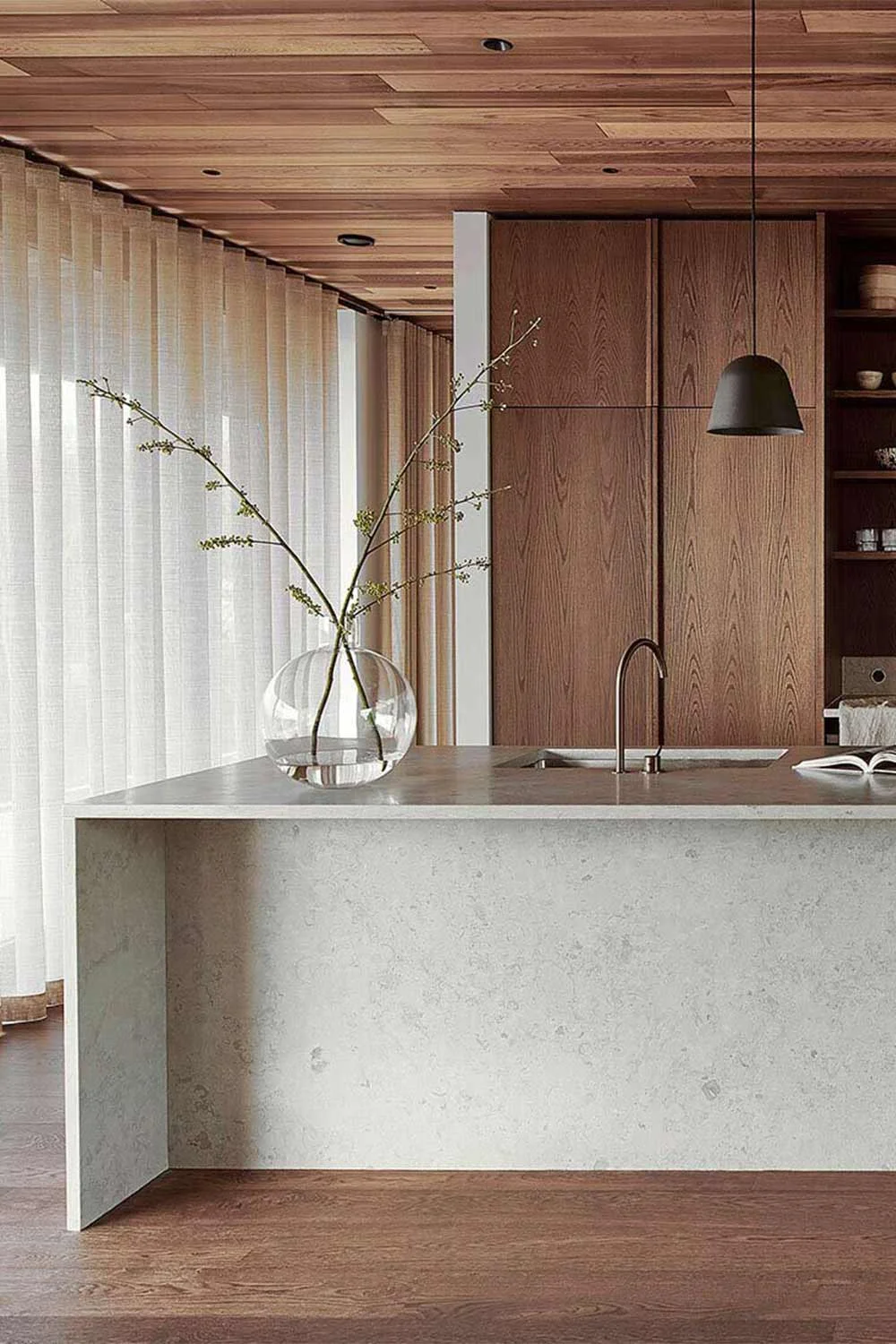 Japandi-Style-Kitchen-Walnut-Cabinetry-Flooring-Concrete-Waterfall-Kitchen-Bench-Sheer-Curtains-Brushed-Nickel-Kitchen-Tap-Open-Shelving
