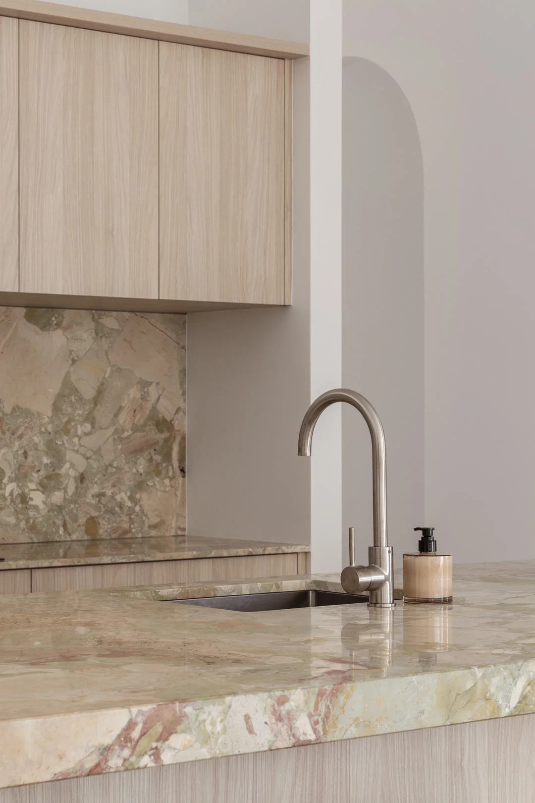 Stainless-Steel-Kitchen-Mixer-Light-Oak-Cabinetry-Green-Marble