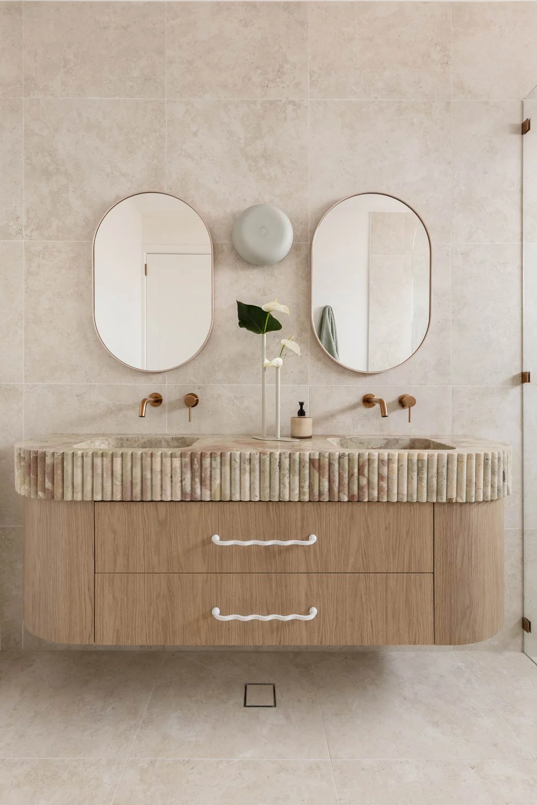 pinky onyx double vanity with scallop edges and brushed copper tapware