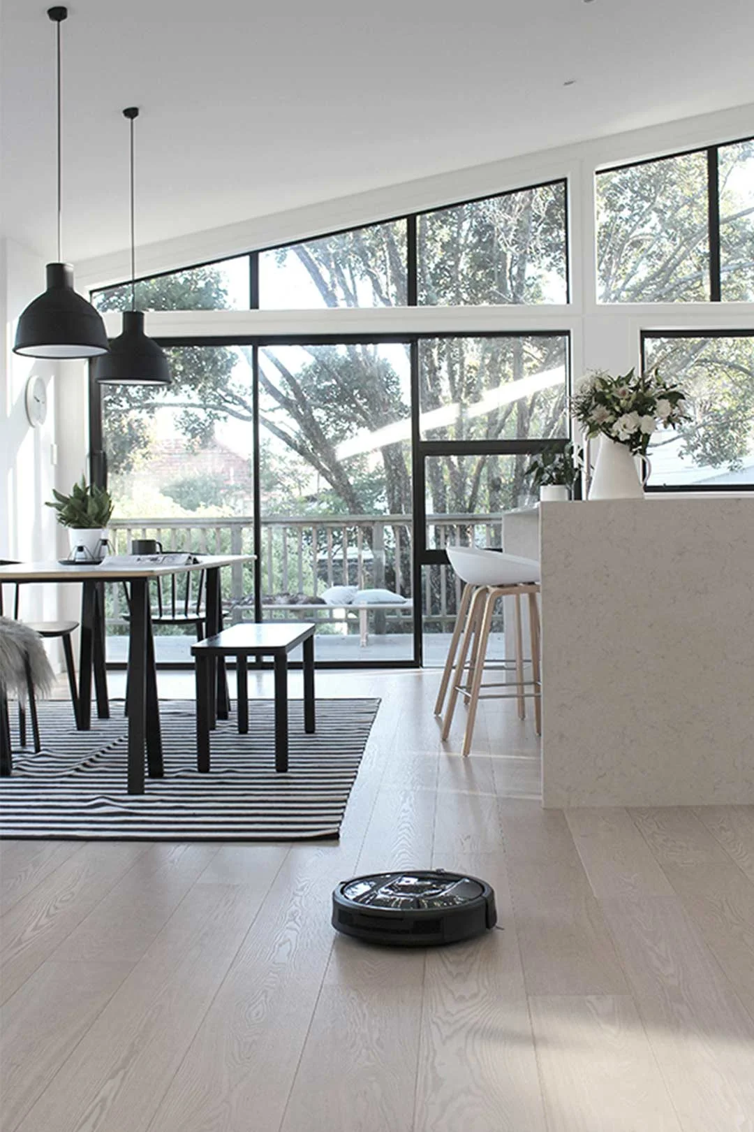 smart-appliances-robot-vacuum-in-scandi-dining-room