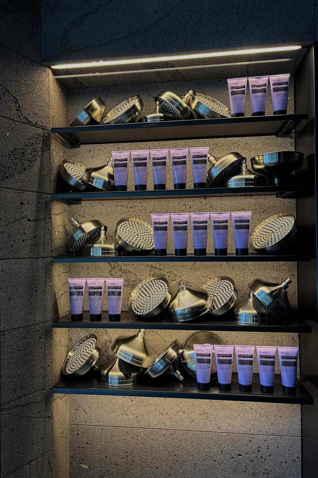 Aesop-Chrome-Shower-Head-and-Product-Display-in-Shop