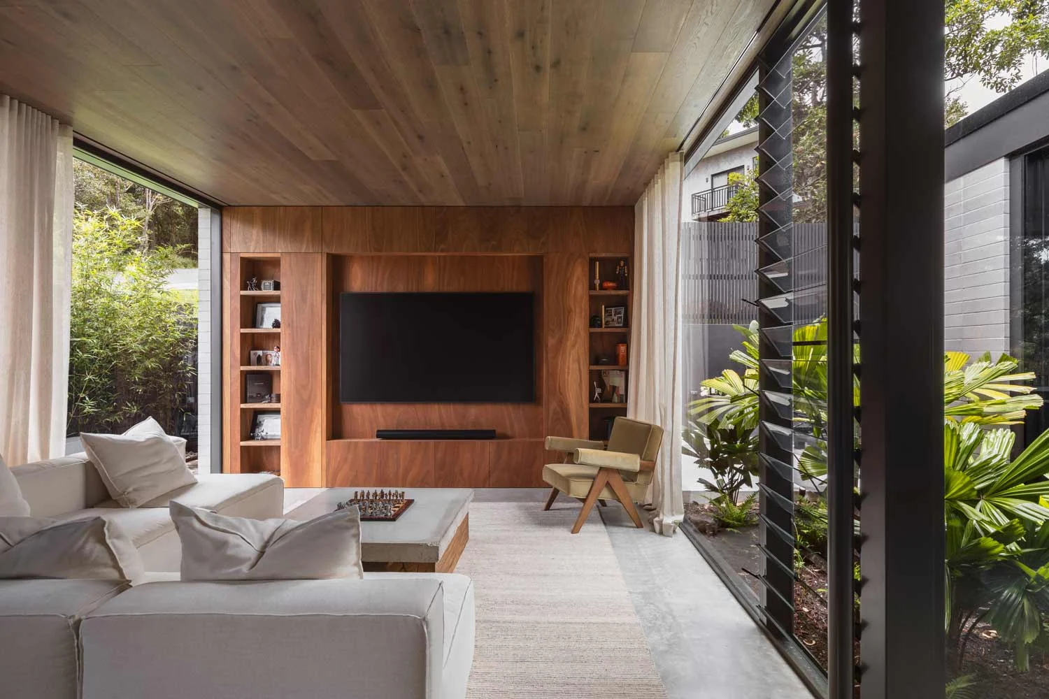 smart-home-technology-speaker-i-living-room-surrounded-by-wood-shelving