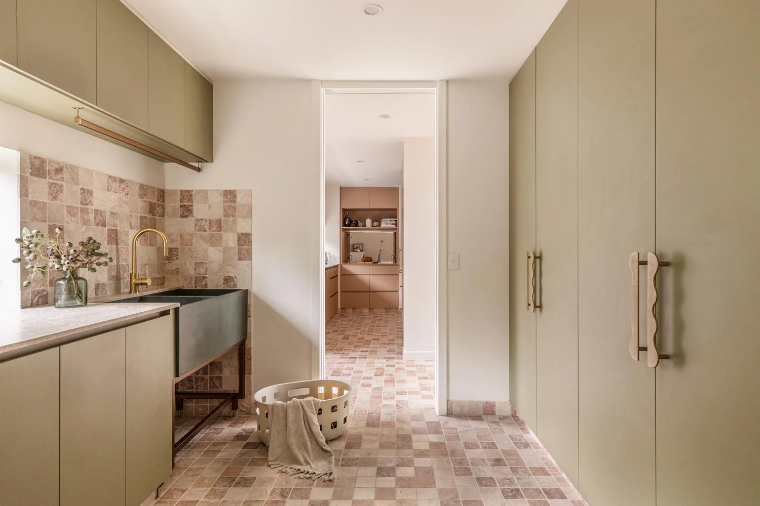 large-green-laundry-with-pink-marble-checker-flooring-and-vintage-sink