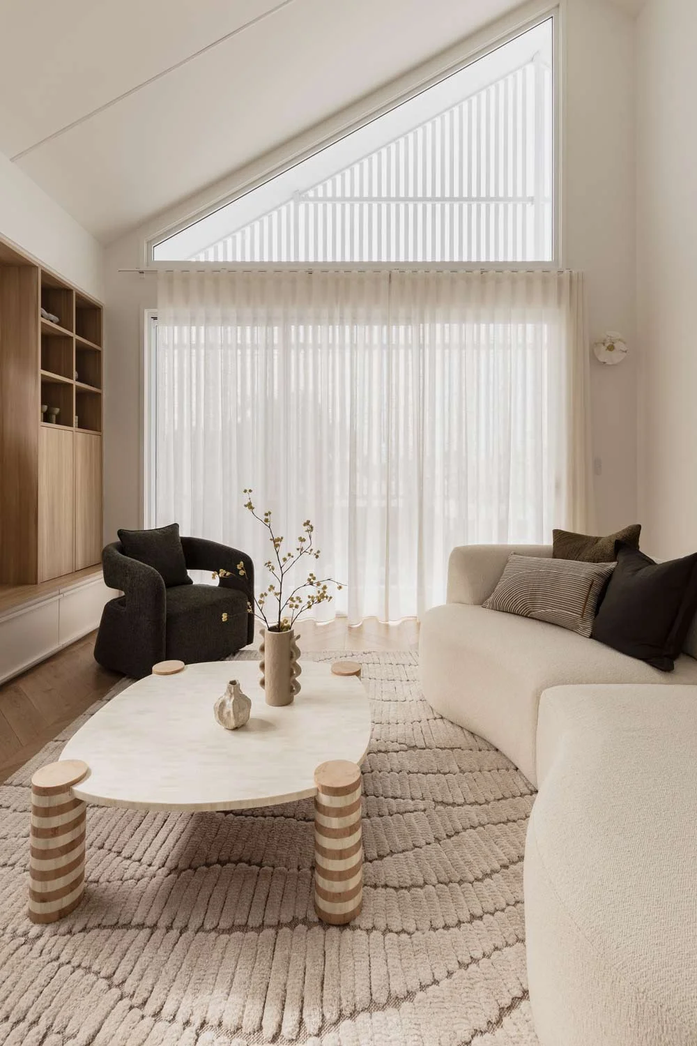 Happy-Haus-Modern-Interior-Design-neutral-earthy-tones-open-plan-living-pitched-roof-sheer-curtains