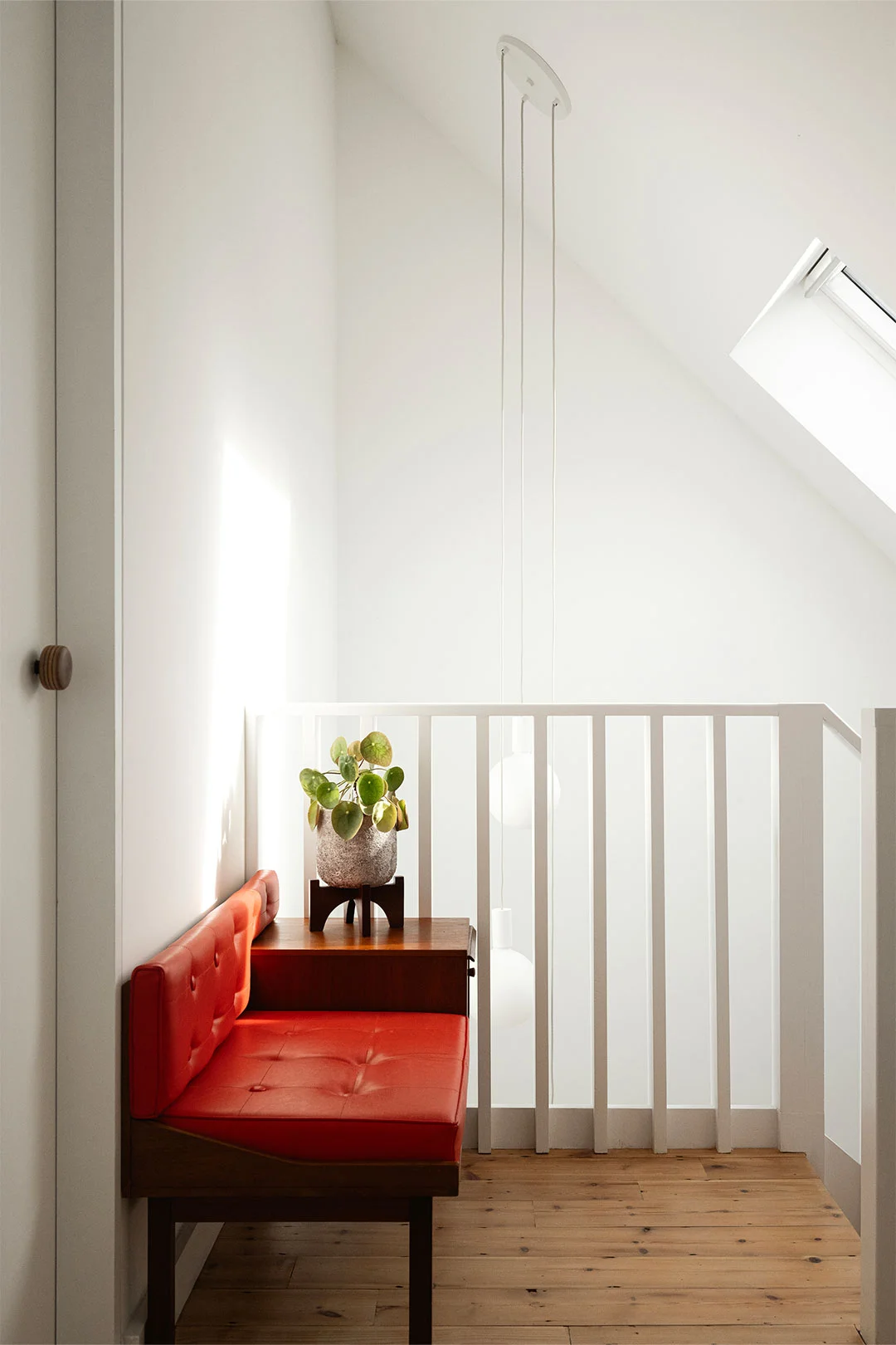Studio-Becoming-hallway-stairwell-design-red-bench-seat