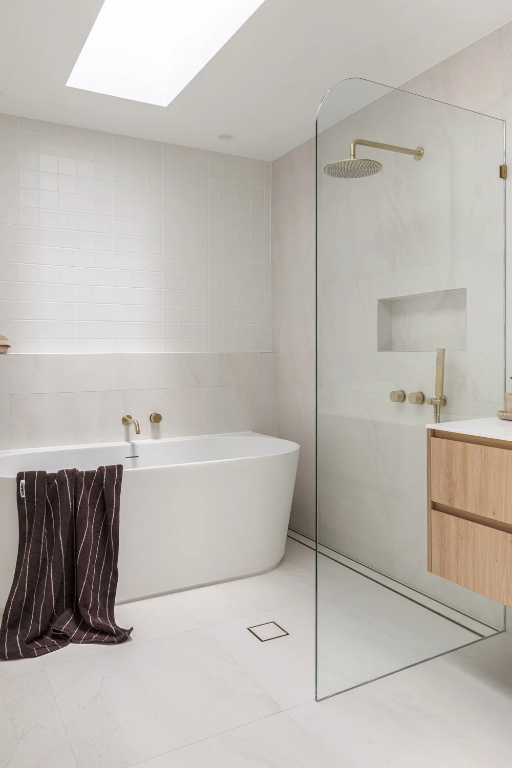 Best-Tile-Bathroom-Floor-Shower-Tile-Niche-Neutral-Tiles-Brushed-Brass-Fixtures-Shower-White-Bath