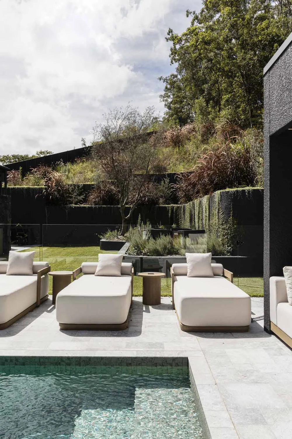 Entertaining-Outdoor-Area-Pool-Dark-Exterior-Lounge-Chairs