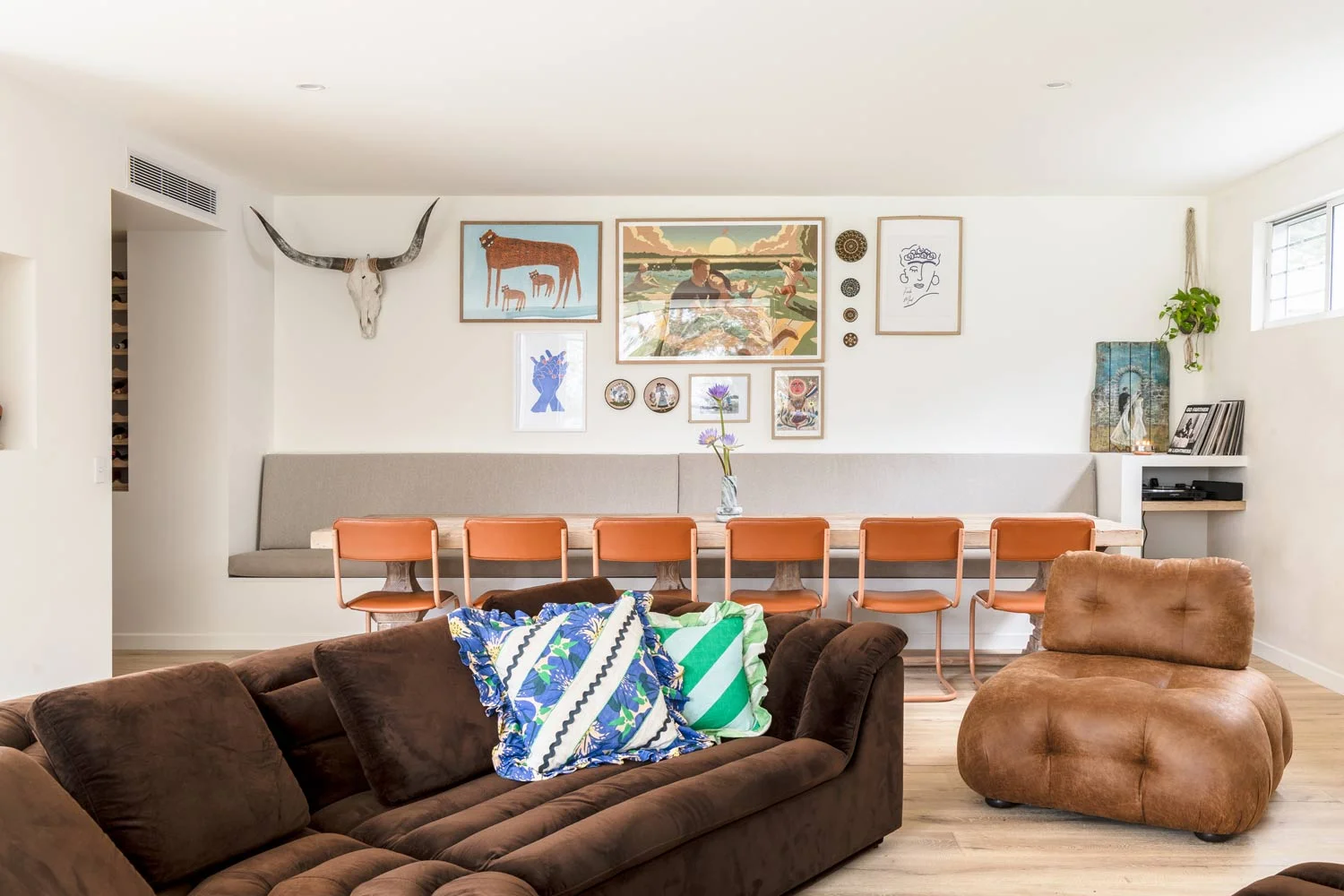 70s-inspired-open-living-and-dining-with-orange-colour-pop-chairs