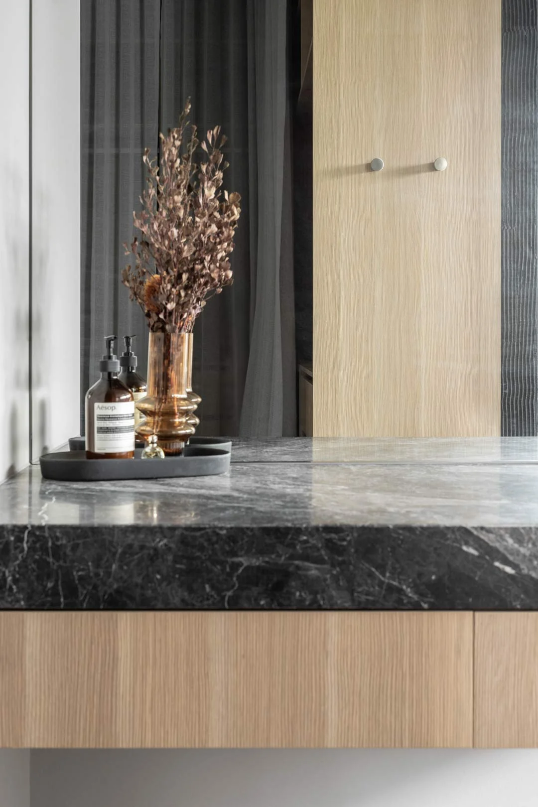 Nero-Marquina-marble-vanity-top-in-moody-interior-bathroom
