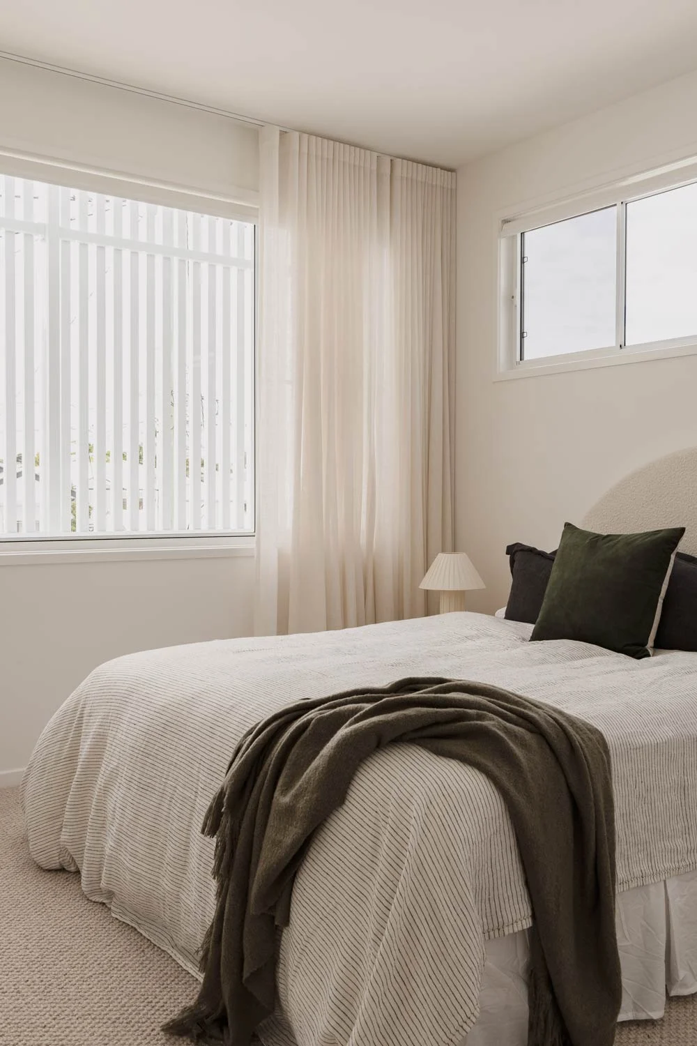 Happy-Haus-Modern-Interior-Design-Coastal-Bedroom-Sage-Green-Pinstripe-Bedding-Sheer-Curtains