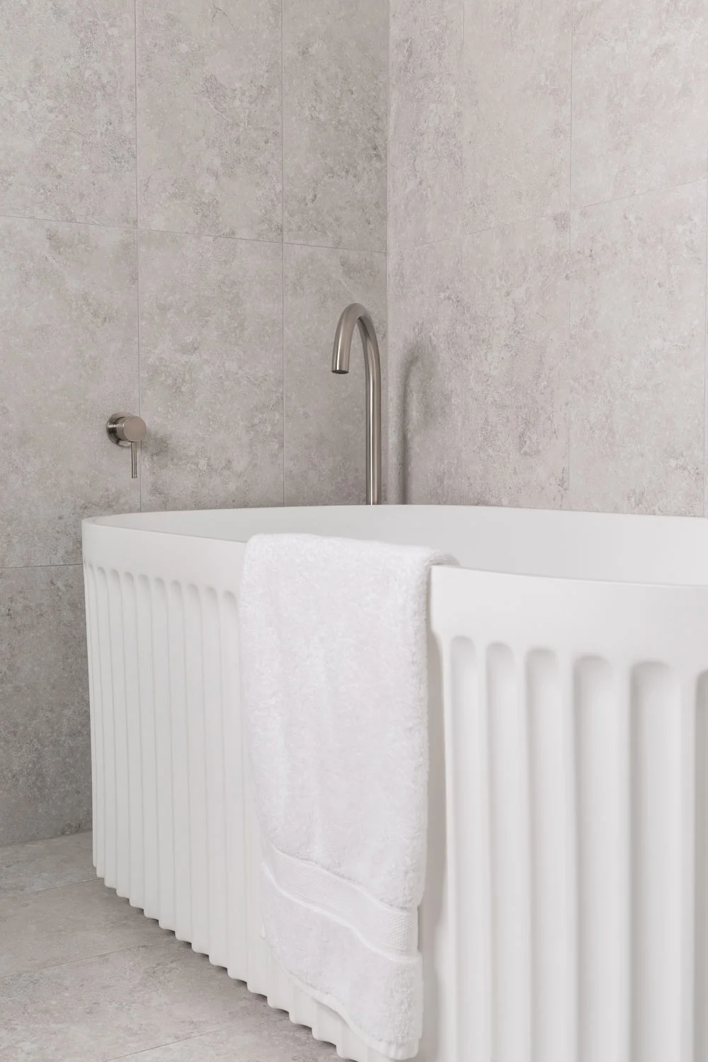 Brushed-Nickel-Bathroom-Fluted-White-Bath-Grey-Tiles