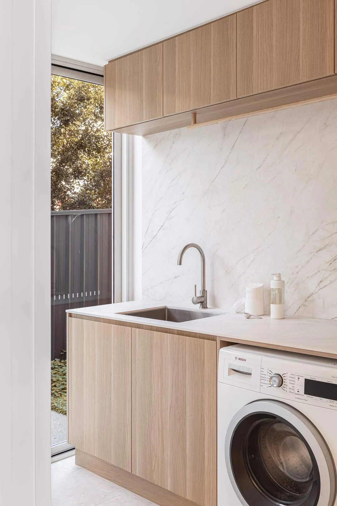 Statuario-Marble-neutral-laundry-with-brushed-nickel-tapware