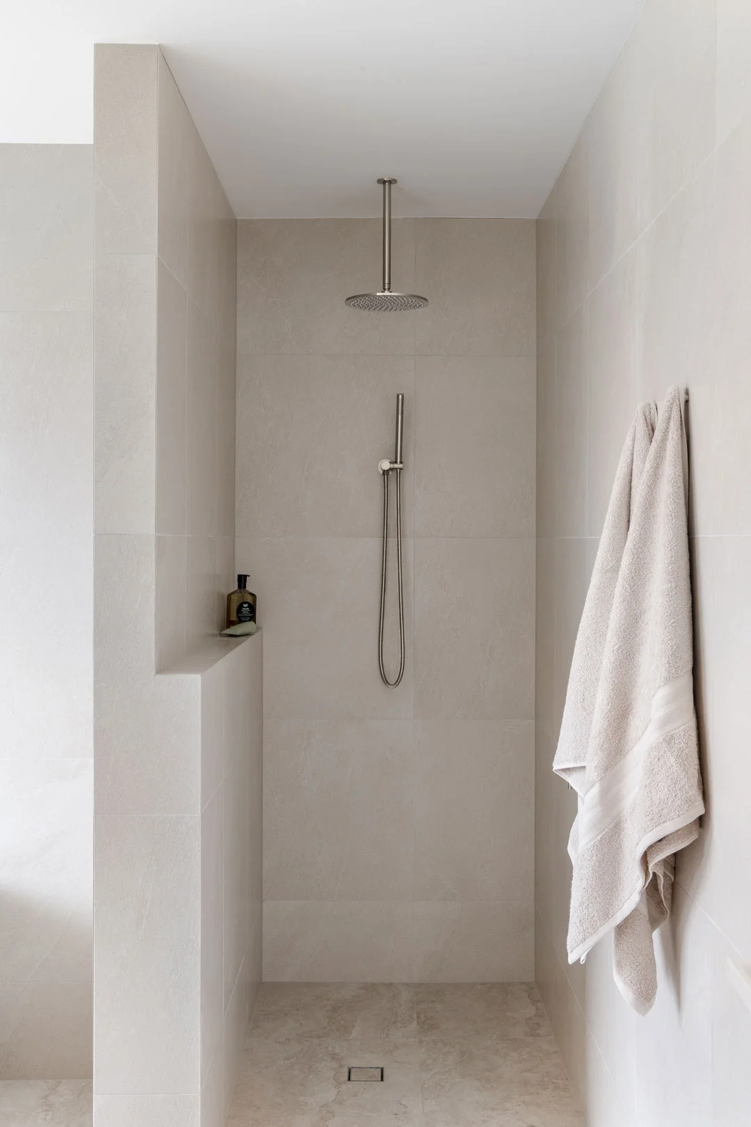 brushed-nickel-shower-set-in-minimal-bathroom