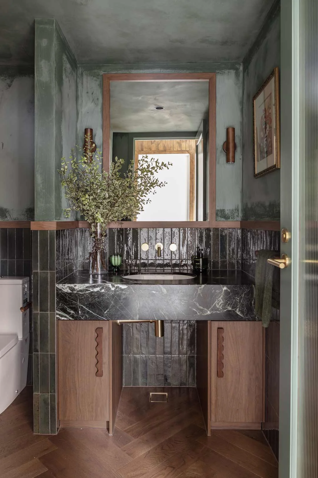 Verde-Alpi-marble-floating-vanity-in-green-powder-room