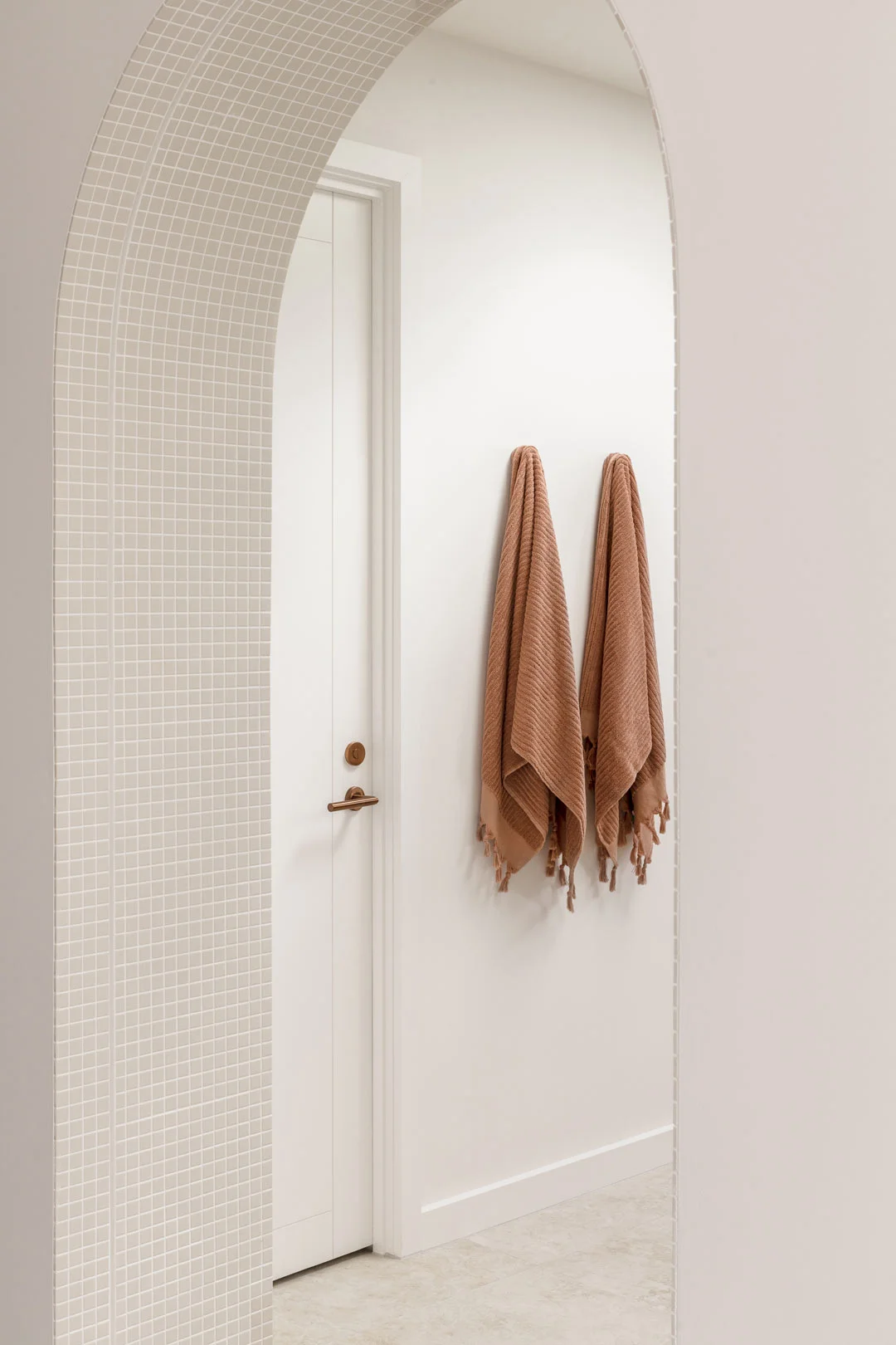 modern mediterranean interior design tiles arch way to bathroom