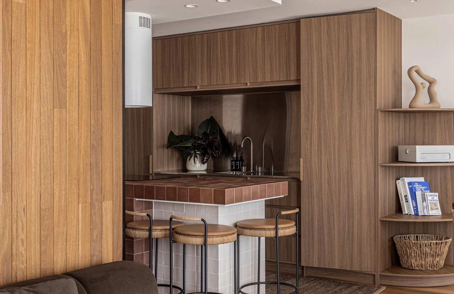 Luxury-Modern-Kitchen-Design-Small-Kitchen-Space-Island-Tiled-Bench-Mirror-Splashback-Wallnut-Cabinetry