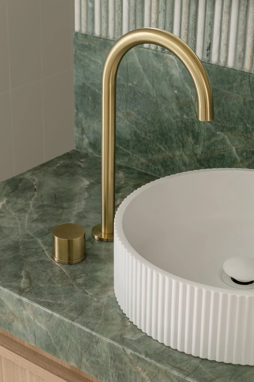 Happy-Haus-Modern-Interior-Design-Brushed-Brass-Tapware-White-Fluted-Basin-Brazillian-Emerald-Quartzile-Bench-Top
