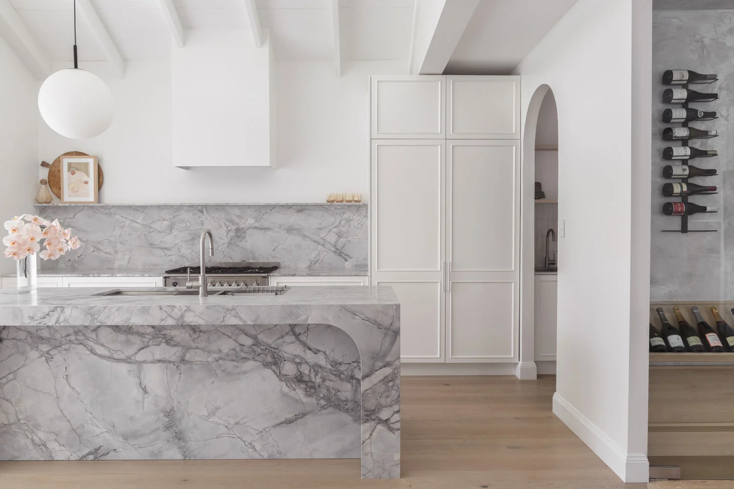 brushed-nickel-kitchen-tap-luxe-grey-marble-stone-kitchen-island-with-wine-cabinet