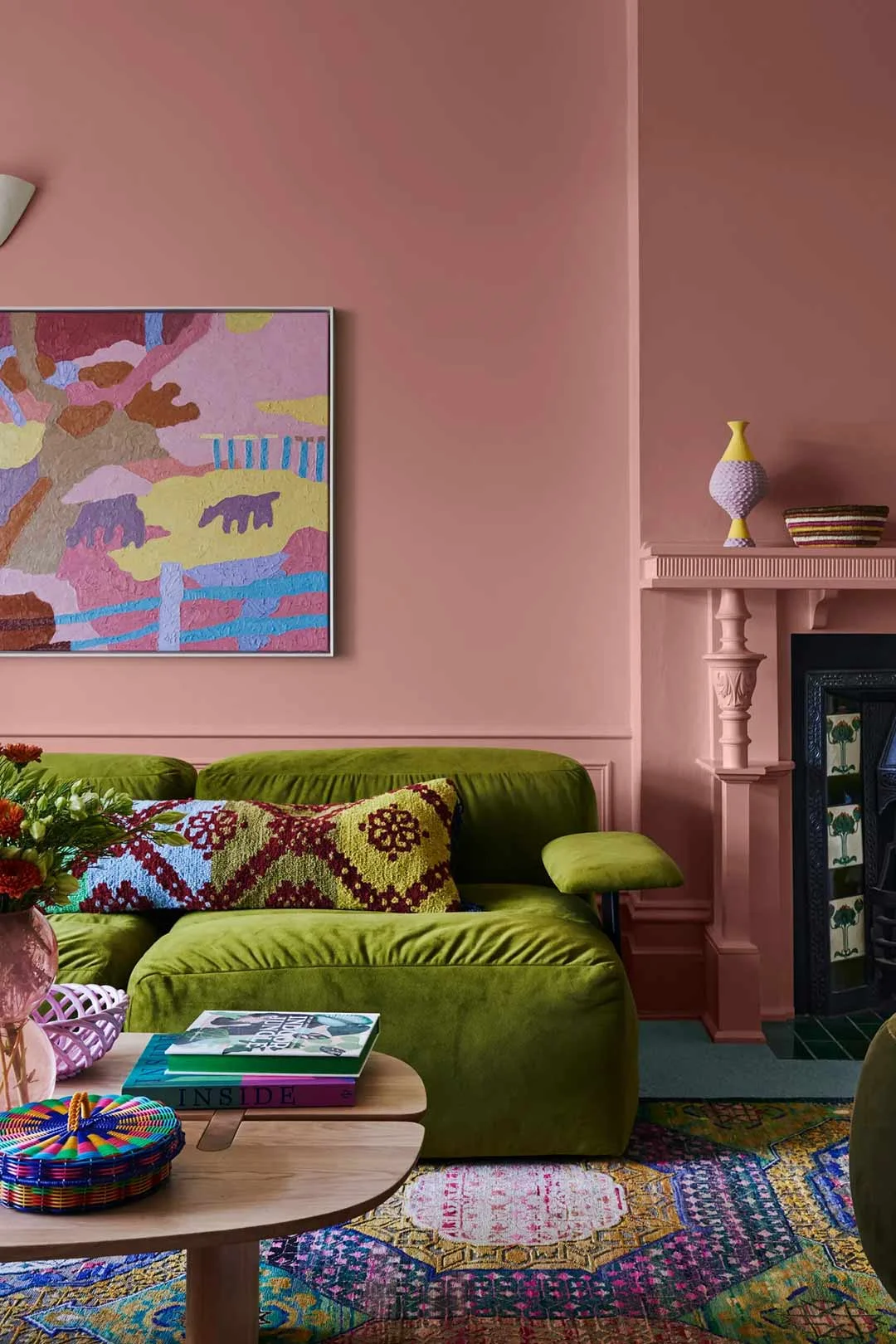 maximalism-home-decor-pink-wall-green-couch-vibrant-interior