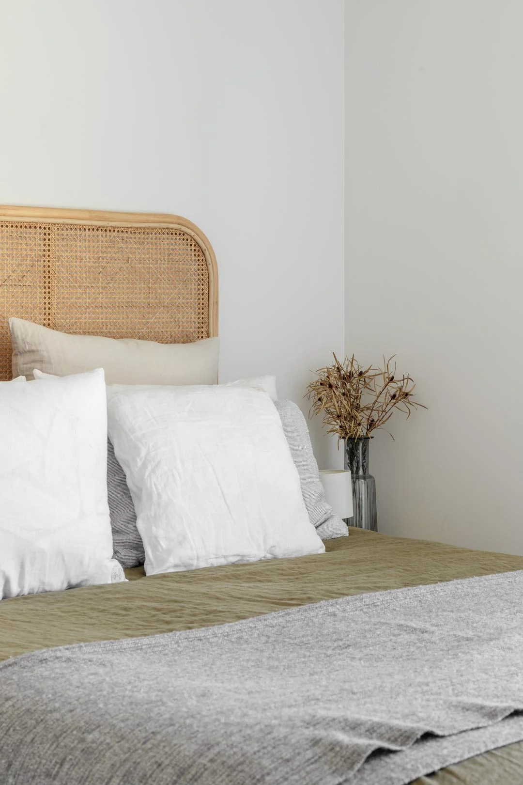 farmhouse-earthy-green-bedroom-decor-with-rattan-bedhead