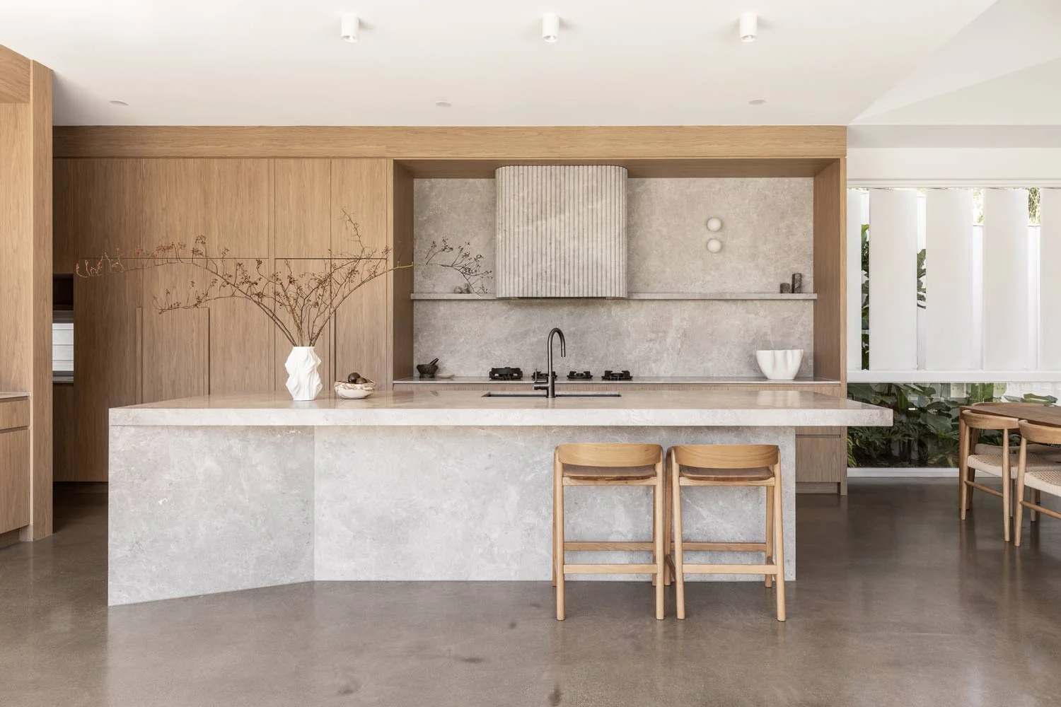 Contemporary-Interior-Design-Modern-Australian-Kitchen-Tundra-Grey-Marble-Oak-Cabinetry-Polished-Concrete-Flooring-Brushed-Gunmetal-Tapware-Kitchen