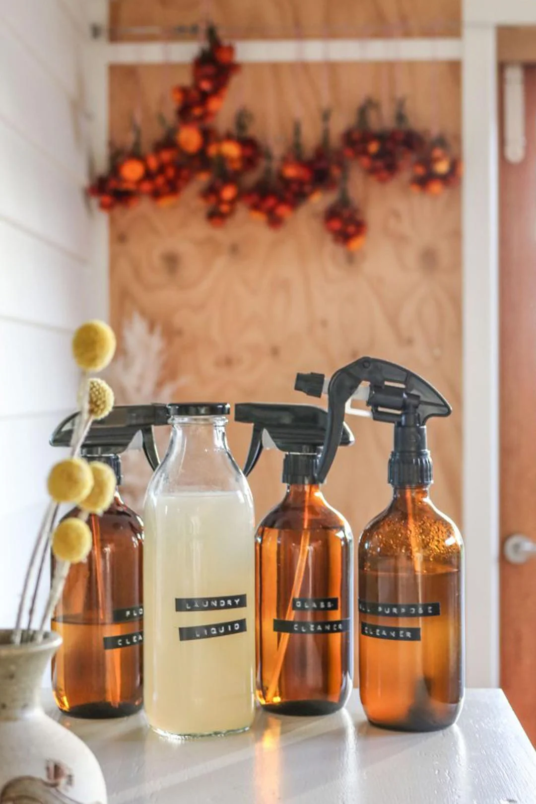 Labeled amber spray bottles to keep your under sink storage neat and tidy