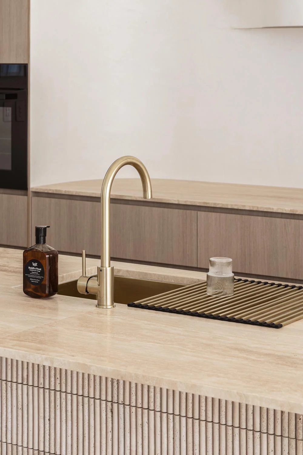 Luxury-Modern-Kitchen-Design-Travertine-Kitchen-Storage-Solution-Concealed-Kitchen-Brushed-Brass-Kitchen-Mixer-Fixtures