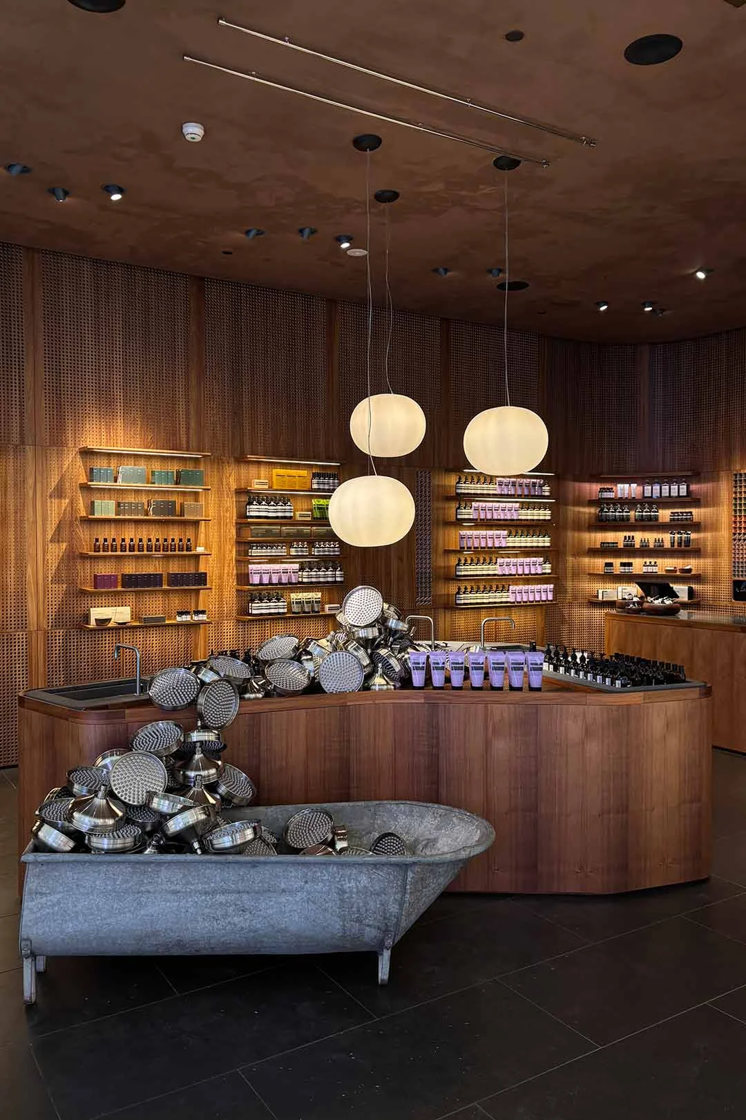 Aesop-Chrome-Shower-head-and-rustic-bath-Shop-Display