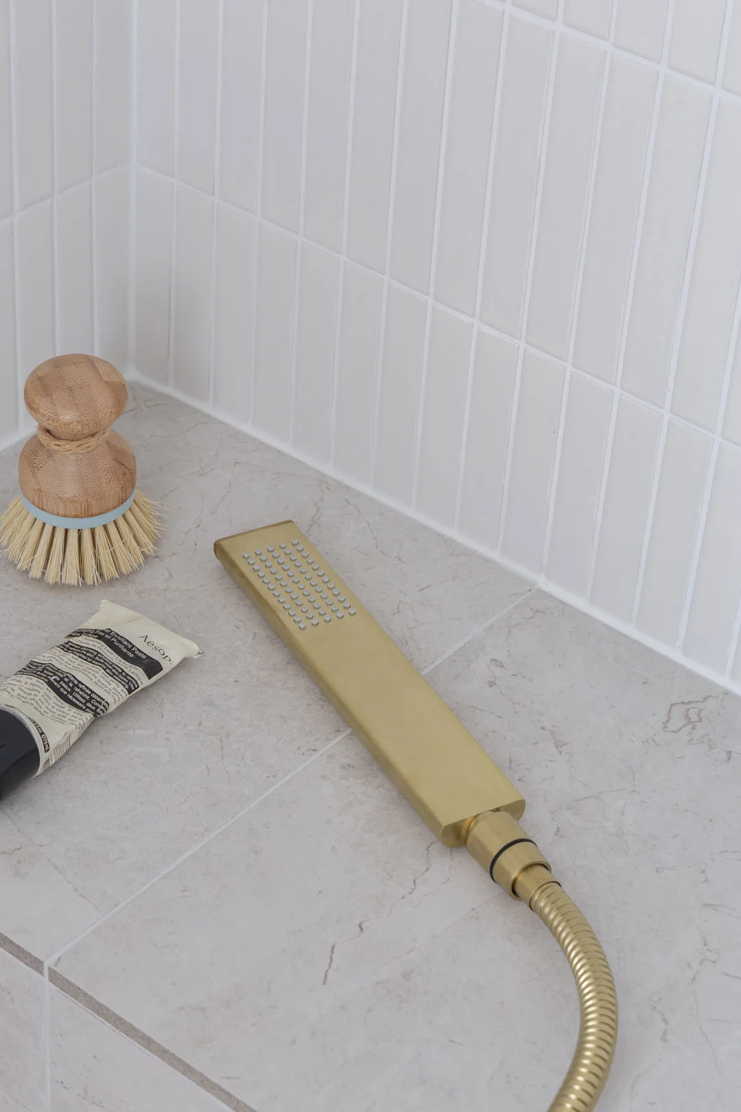 brushed-brass-hand-shower-tile-grout-cleaning-tips