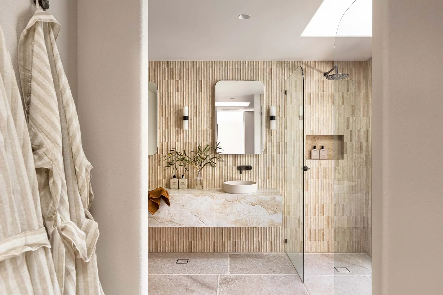 Organic-Modern-Interior-Design-Bathroom-Ensuite-Open-Shower-Travertine-Fluted-Tiles-Concrete-Basin-Brushed-Gunmetal-Shower-Tapware