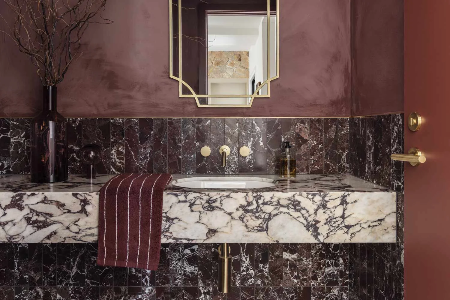 marble-luxe-powder-room-burgundy-and-white-interior