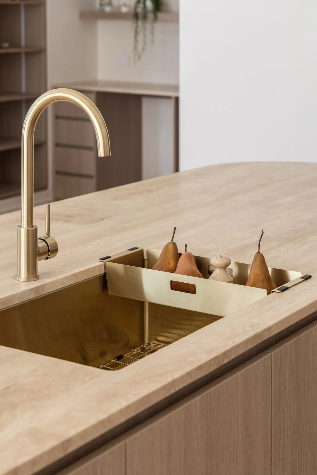 Brass-Tapware-Kitchen-Mixer-Brass-Sink-Colander-Travertine-Benchtop-Timber-Cabinetry