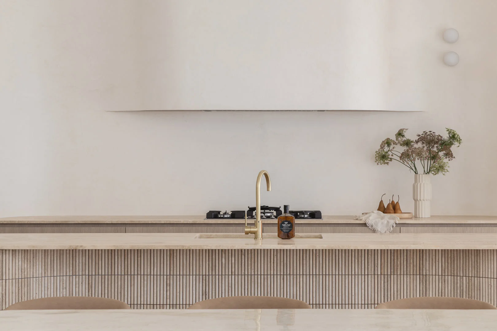 Brass-Tapware-Kitchen-Mixer-Travertine-Tiles-Render-Walls