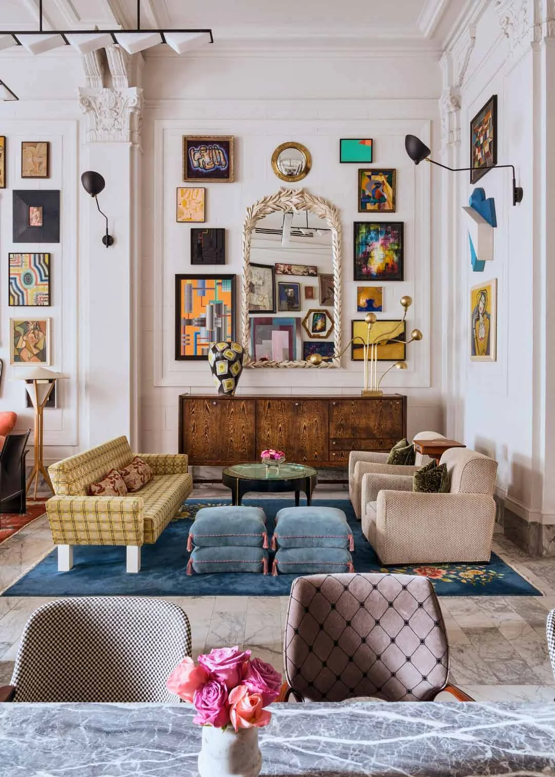 A gallery wall in this San Franscisco Hotel showcases hipstoric interior design bringing vintage features into the modern era