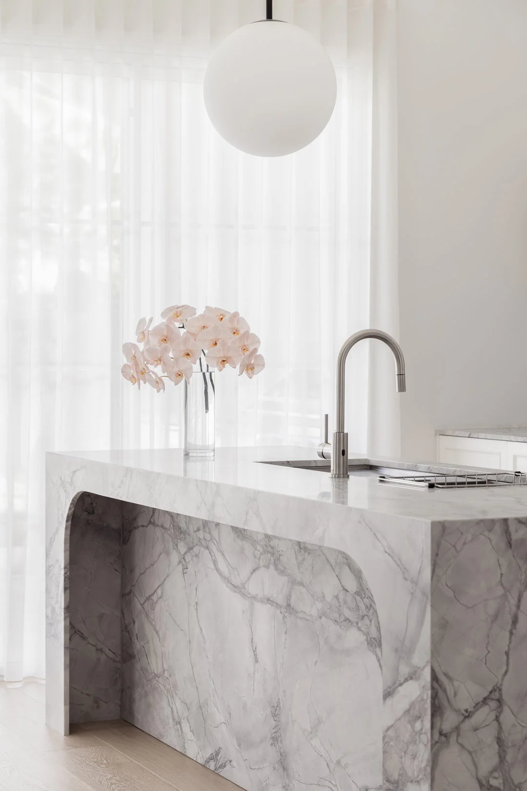 brushed-nickel-kitchen-tap-with-grey-marble-stone-kitchen-island